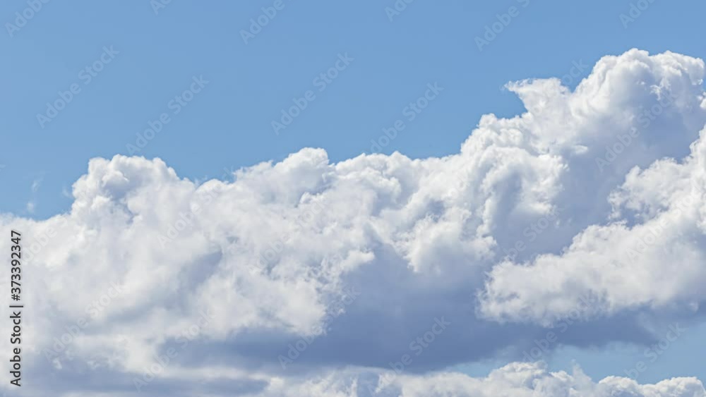 Time lapse: Clouds swirling and tumbling in the blue sky on a summer day. Weather, climate change and spiritual concepts. Time lapse: Clouds swirling and tumbling in the blue sky on a summer day. Weather, climate change and spiritual concepts.