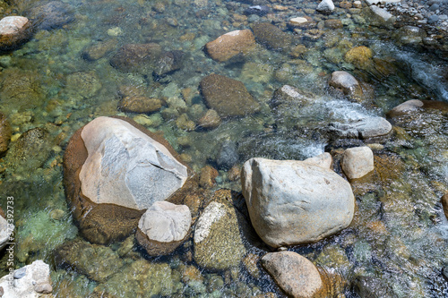 Clear mountain waters flow among the rocks of the Franconia Branch