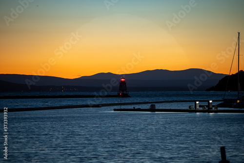 Sunset over the Adirondacks of upstate New York across Lake Champlin from the Burlington waterfront pier