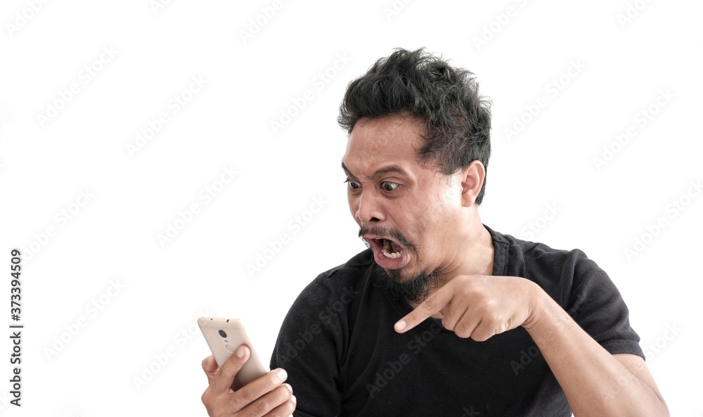 rage asian man on phone, angry expression while looking phone rage asian man on phone, angry expression while looking phone