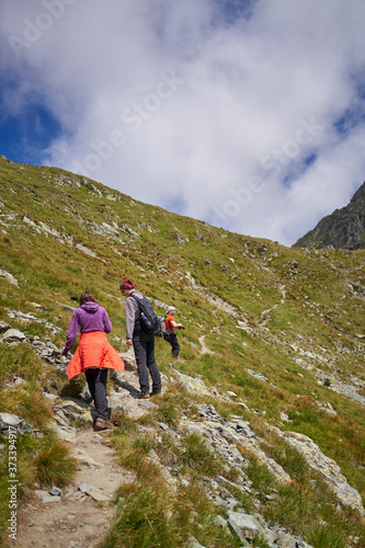 Family hiking into the mountains