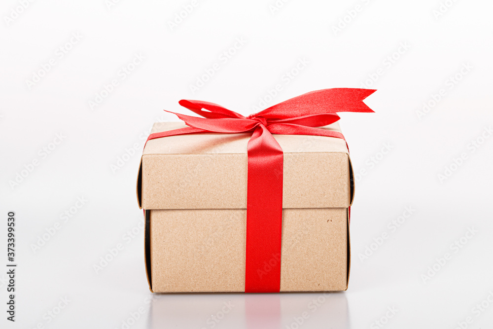 Fototapeta premium Gift box with red bow tie on white background