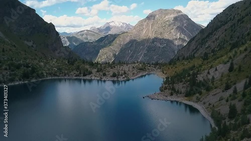 Soft pan up of Lake Lauvitel, showing the Venosc Mountains, Franch Alps. Pro Res photo