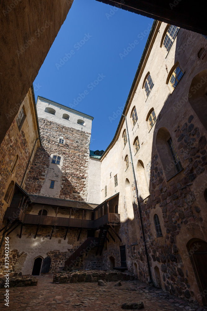 Inner courtyard of the medieval and historical Turku Castle in Turku, Finland on a sunny day in the summer.