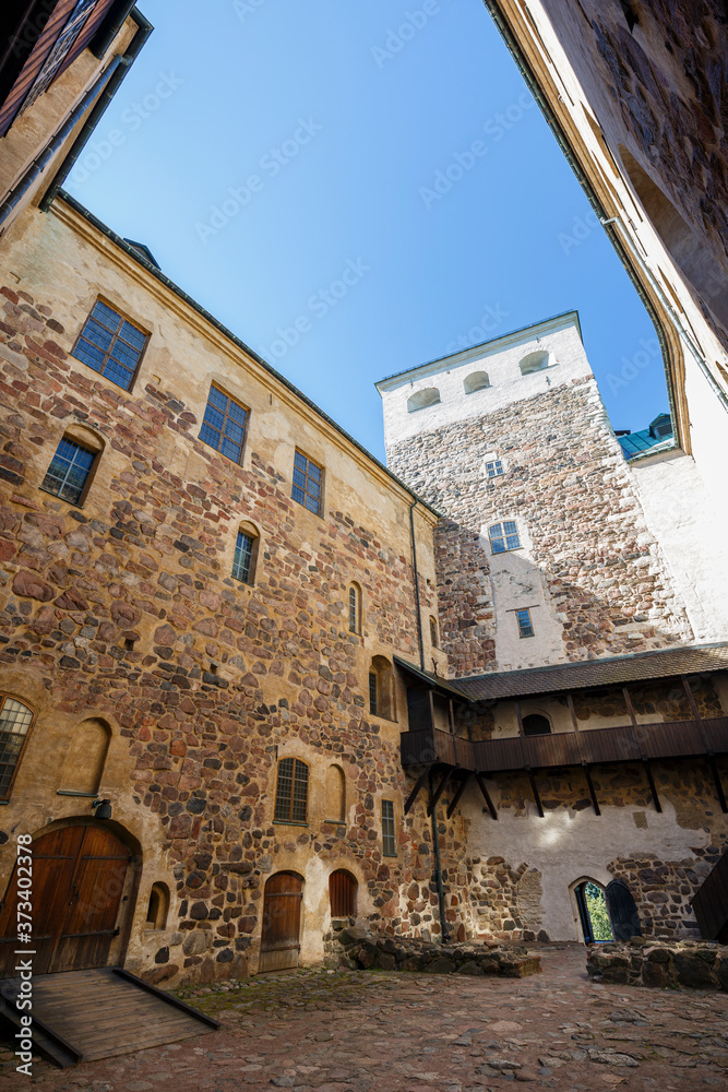 Inner courtyard of the medieval and historical Turku Castle in Turku, Finland on a sunny day in the summer.
