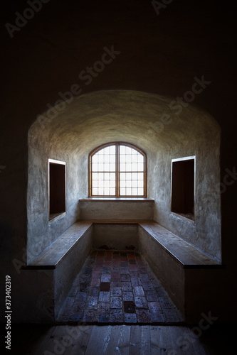 Window and benches on a thick wall at the medieval and historical Turku Castle in Turku, Finland. © tuomaslehtinen