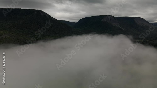 The Chic-Choc Mountain Of Gaspe Peninsula Throughout Hazy Day In Quebec, Canada. - Aerial Shot photo