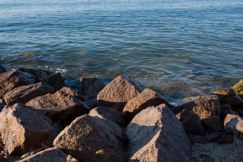 stones in the water on the seashore stones in the water on the seashore