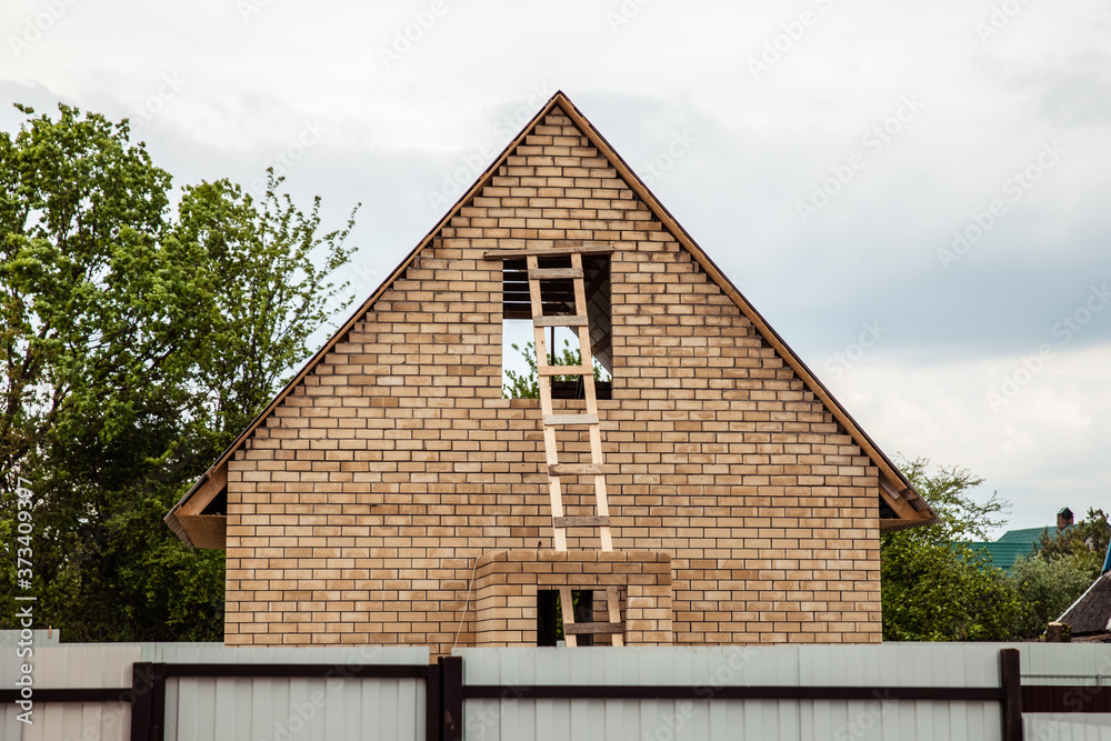 Wooden staircase to attic. staircase to the roof of the house Wooden staircase to attic. staircase to the roof of the house
