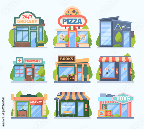 Fototapeta Naklejka Na Ścianę i Meble -  Stores and market set. Facade colored shops pharmacies retail outlets book galleries toy store food medicine sales city boutiques with showcases awnings modern small buildings. Cartoon vector.