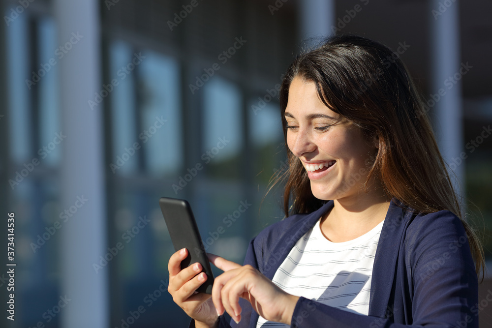 Woman using smart phone in a terrace a sunny day Woman using smart phone in a terrace a sunny day