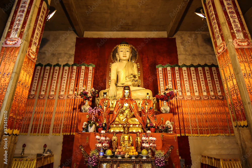 JingAnSi, Jingan Qu, Shanghai, China - 15 April 2019  : A Golden Statue of Guanyin known as the goddess of compassion and mercy, is enshrined within the Jing' An Temple for visitors' worshiping.