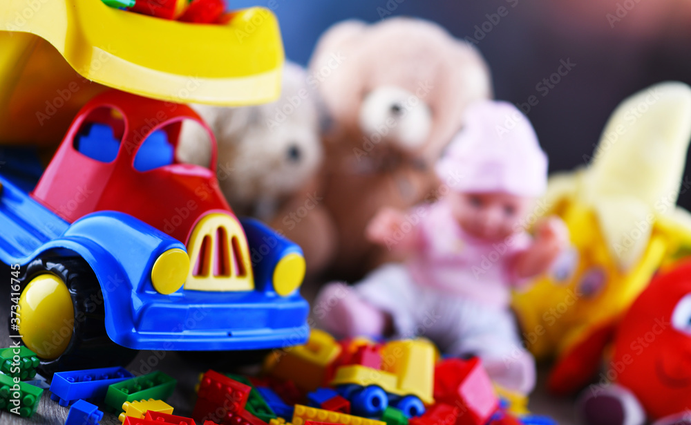 Naklejka premium Colorful plastic and plush toys in a children's room