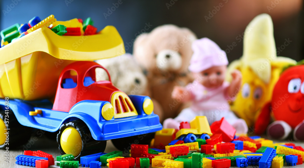 Naklejka premium Colorful plastic and plush toys in a children's room