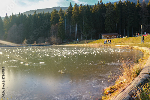 Laghetto ghiacciato di Roana sull'Altopiano di Asiago, paesaggi e natura d'inverno in Veneto photo