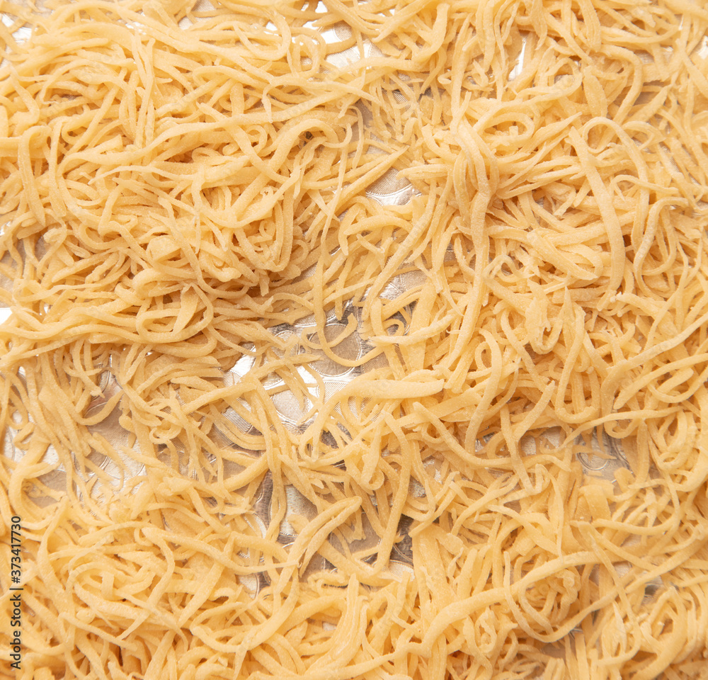 Sliced dough noodles on the table Sliced dough noodles on the table