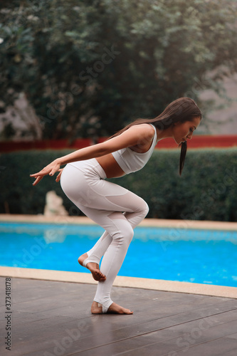 Asia Yoga instructor, in outdoor exercise. Portrait of gorgeous asian young woman practicing yoga outdoor