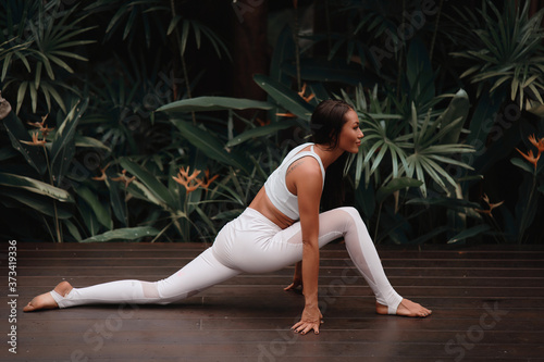 Asia Yoga instructor, in outdoor exercise. Portrait of gorgeous asian young woman practicing yoga outdoor