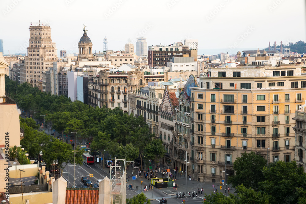 Architecture of Passeig de Gracia main avenue of Barcelona in summer day.