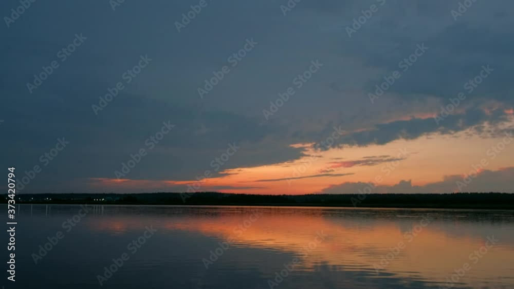 Evening colorfull sunset on the background of a lake in the forest. 4k uhd. Evening colorfull sunset on the background of a lake in the forest. 4k uhd.