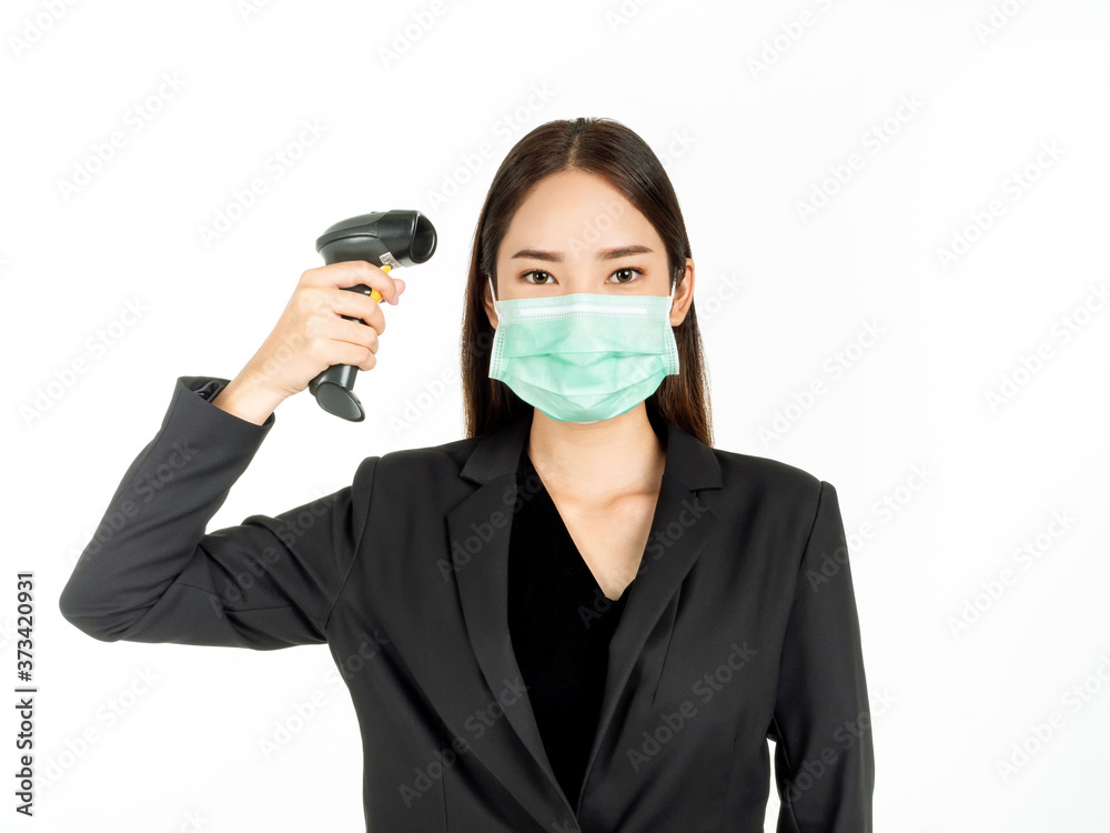 Asian woman wearing green medical mask holding infrared thermometer or digital Thermometer gun isolated on white background. Asian woman wearing green medical mask holding infrared thermometer or digital Thermometer gun isolated on white background.