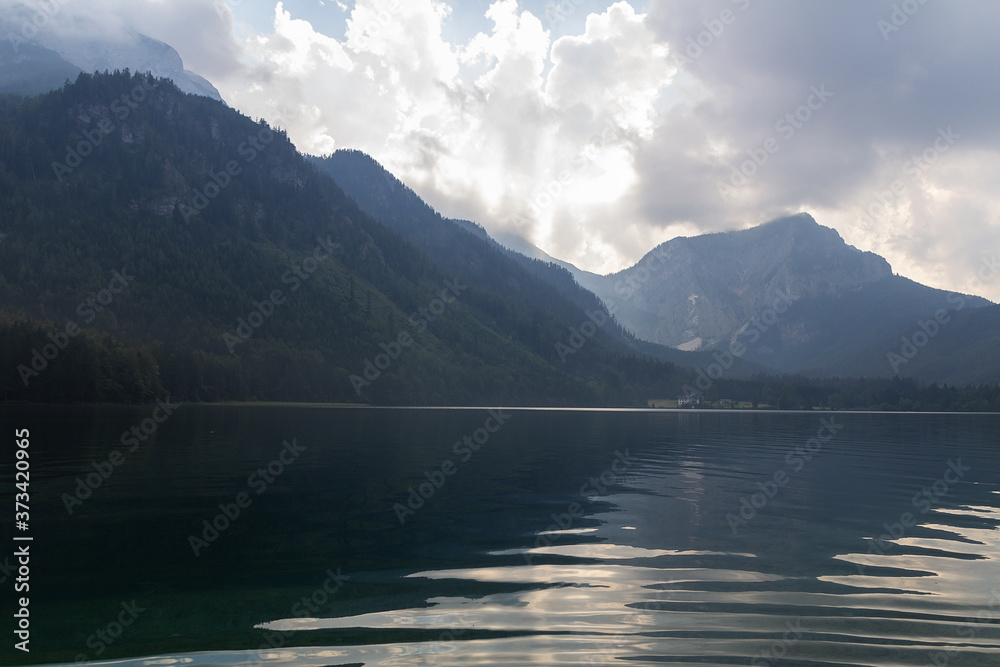 Nice sun rays over Vorderer langbathsee lake in Austria Alp mountain