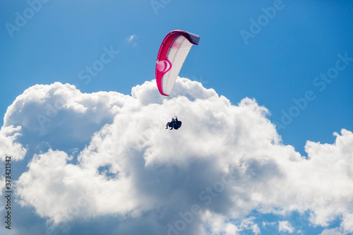 Paragliding in the sky on a sunny day.