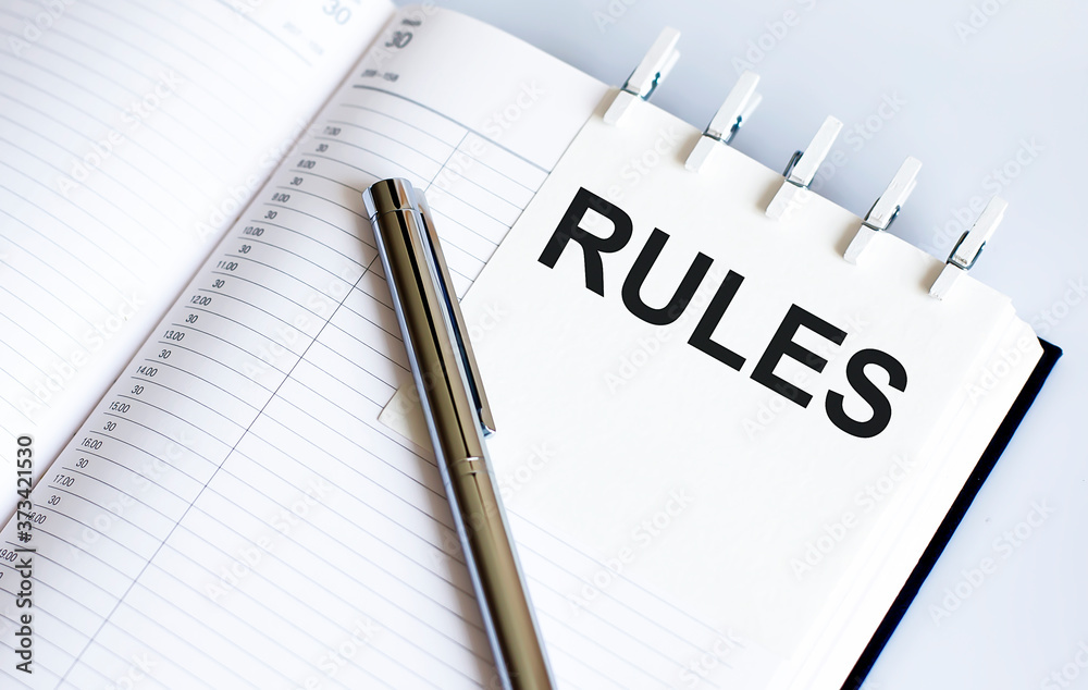 text RULES on the short note texture background with pen text RULES on the short note texture background with pen