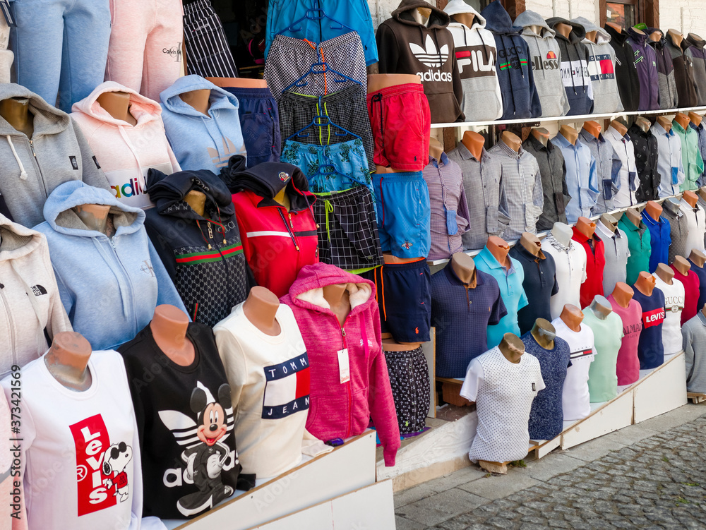 Kalkan, Turkey - July 30, 2018:Counterfeit or fake designer clothing for  sale outside shop in the busy harbour area of Kalkan Stock Photo | Adobe  Stock