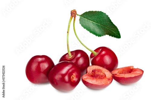 red cherry fruit with green leaf isolated on white background