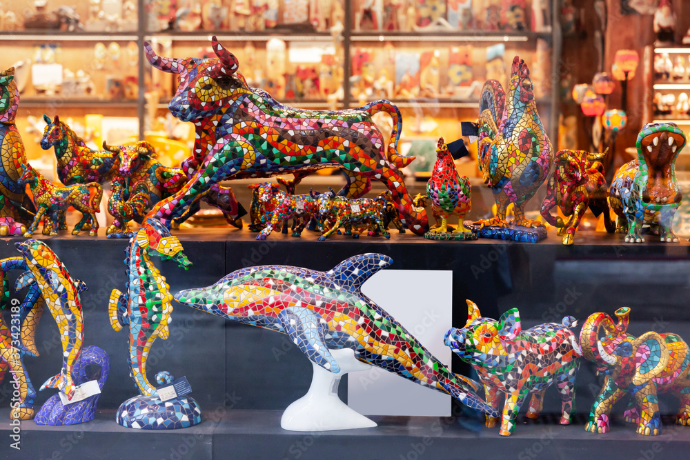 Colorful Mosaic figures - Souvenirs of Barcelona on showcase in store