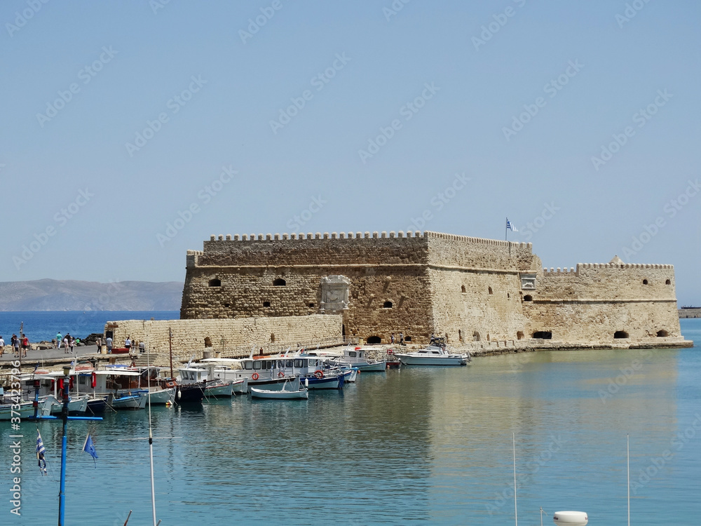 Tourist visit ruins of Fortifications of Chania on Crete Island, Greece. The fortifications of Chania are a series of defensive walls surround the city of Chania in Crete.