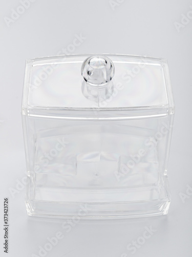 transparent plastic food storage container with white lid