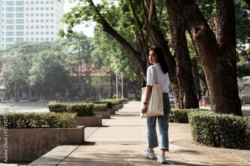 Walking girl in university s park.
