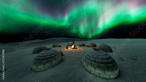 Aurora borealis with eskimo house and fire camp photo
