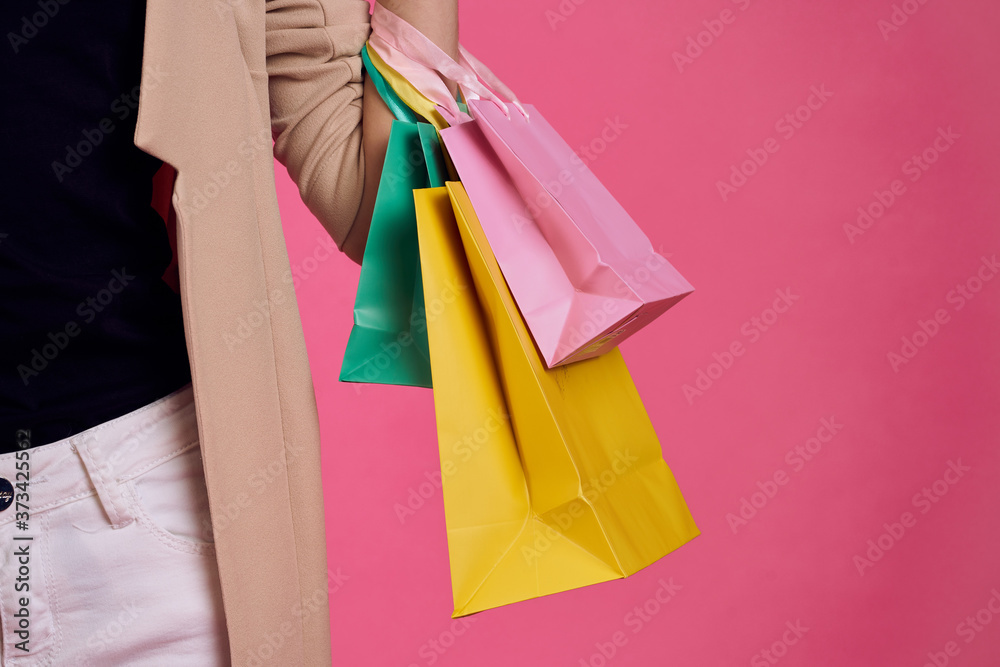 Multicolored packages Shopping lifestyle pink background