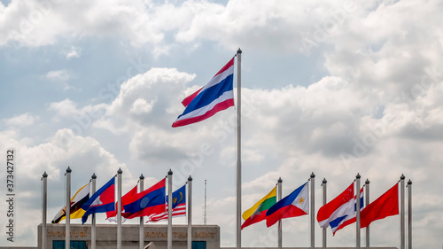 Flags of Asian states fly near the Royal Thai Mint building in Bangkok, Thailand