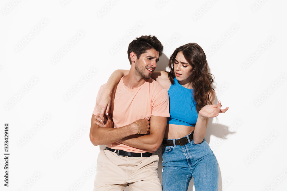 Image of attractive young couple hugging and talking Image of attractive young couple hugging and talking