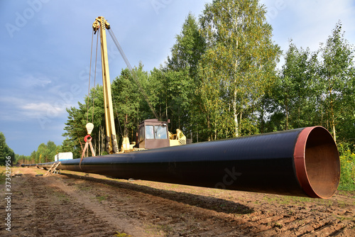 LNG pipeline construction project for global exports of natural gas. Building of transit petrochemical pipe in forest area. Carry diluted bitumen and crude to international markets. Oil and gas