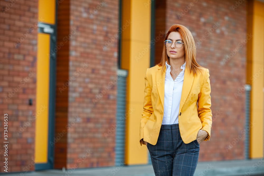 Confident business expert. Happy successful professional posing near office building. European girl. Russian business lady. Female business leader concept. Portrait Of Successful Business Woman Confident business expert. Happy successful professional posing near office building. European girl. Russian business lady. Female business leader concept. Portrait Of Successful Business Woman