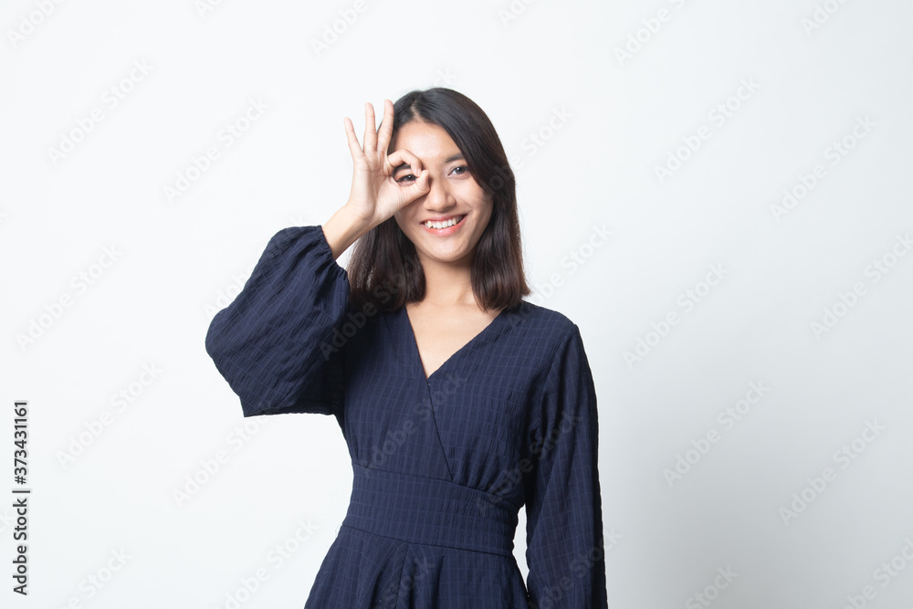 Beautiful young Asian woman show OK sign over her eye. Beautiful young Asian woman show OK sign over her eye.