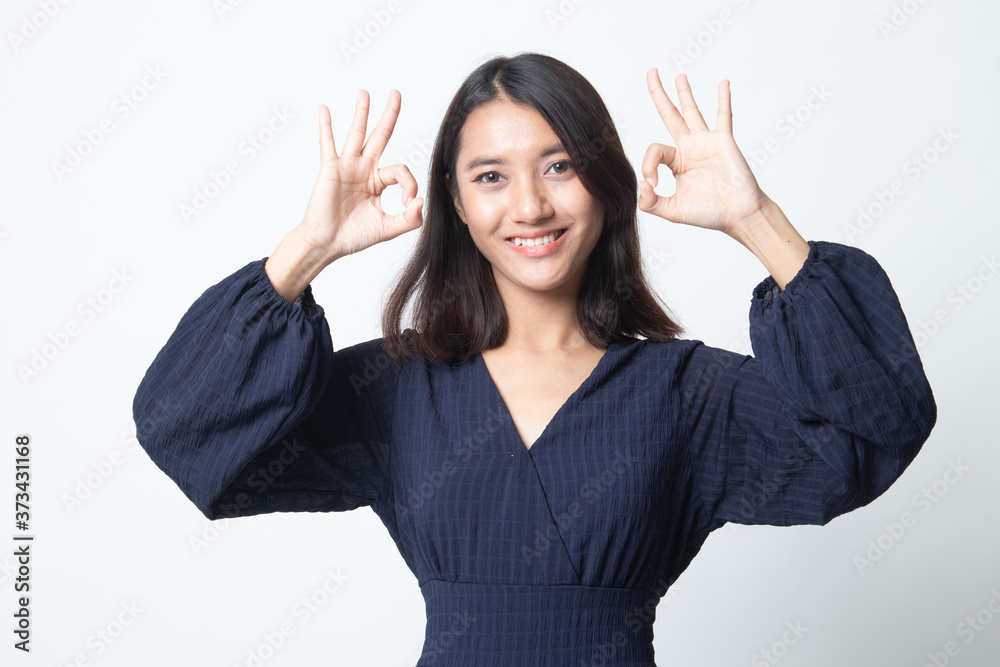 Asian woman show double OK hand sign and smile. Asian woman show double OK hand sign and smile.
