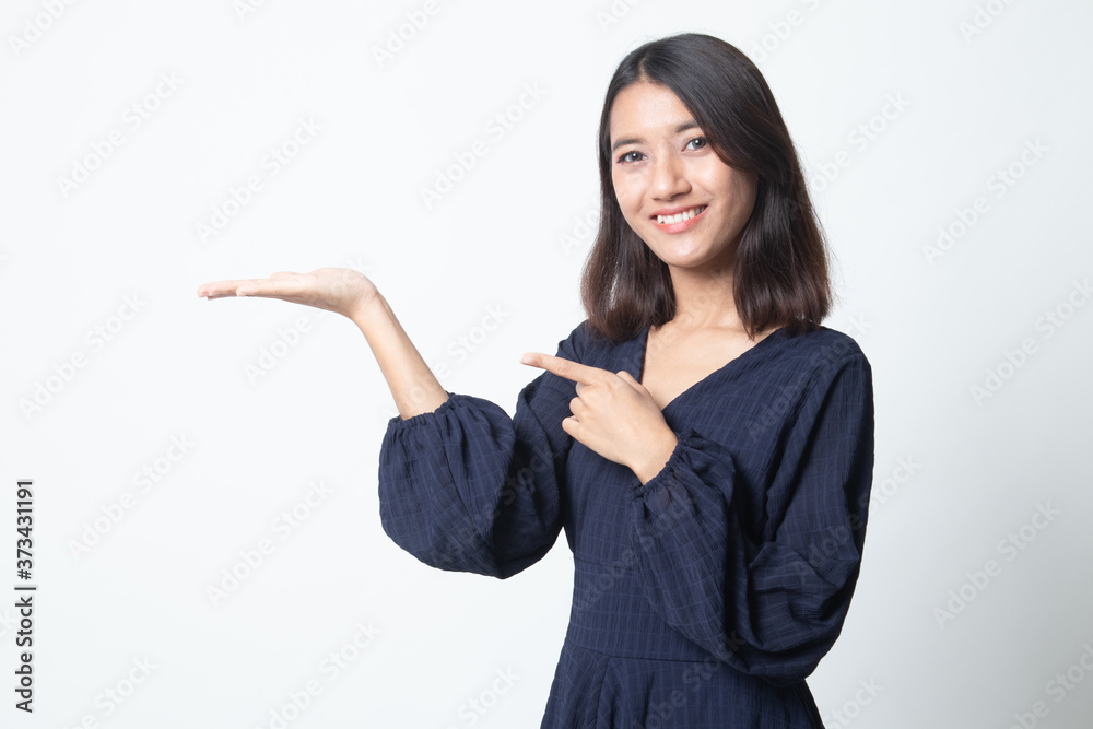 Beautiful young Asian woman point to palm hand. Beautiful young Asian woman point to palm hand.