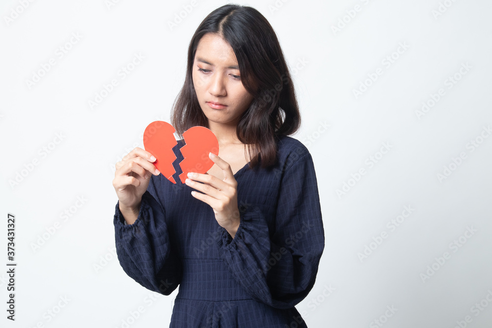 Beautiful young Asian woman with broken heart. Beautiful young Asian woman with broken heart.