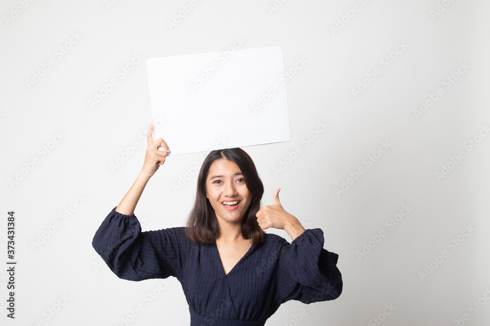 Young Asian woman show thumbs up with white blank sign. Young Asian woman show thumbs up with white blank sign.