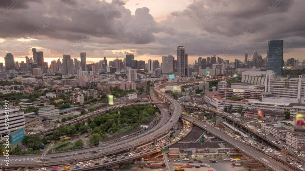 Time lapse Aerial view and top view of traffic on city streets in Bangkok , Thailand. Expressway with car lots. Beautiful roundabout road in the city center. Time lapse Aerial view and top view of traffic on city streets in Bangkok , Thailand. Expressway with car lots. Beautiful roundabout road in the city center.