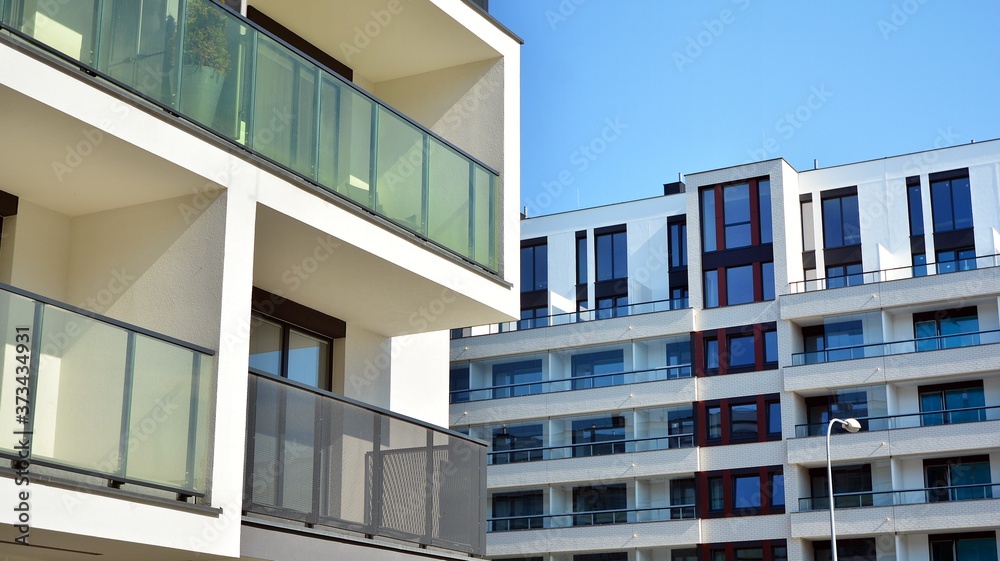 Architectural details of modern apartment building. Modern european residential apartment building complex. Architectural details of modern apartment building. Modern european residential apartment building complex.