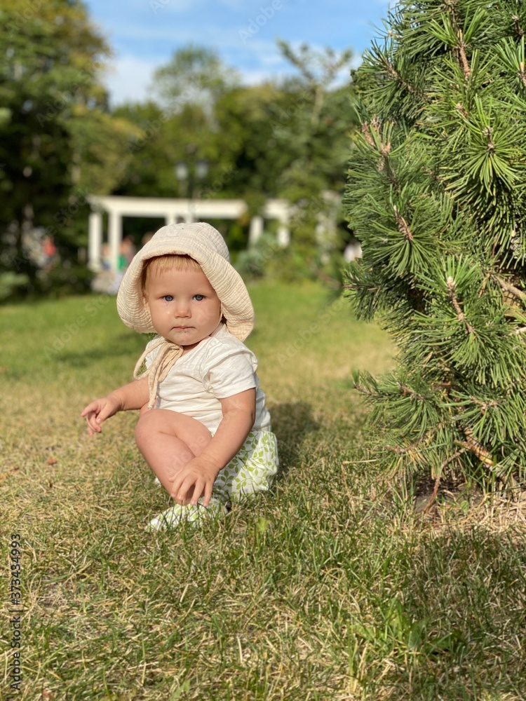 little girl sitting on the grass little girl sitting on the grass