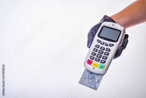 Payment terminal. Hand in glove. Safe shopping concept