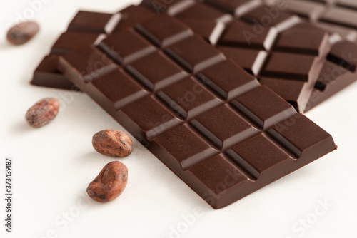 Bar of chocolate and cocoa beans.
